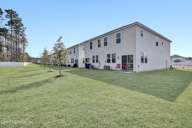 rear view of house featuring a patio area, central air condition unit, a yard, and fence