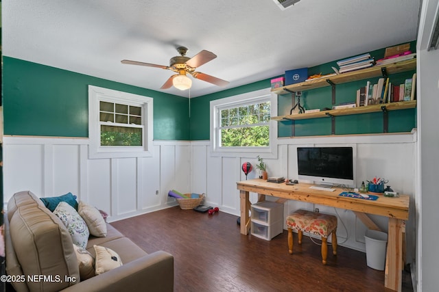 office area featuring wainscoting, a ceiling fan, and wood finished floors