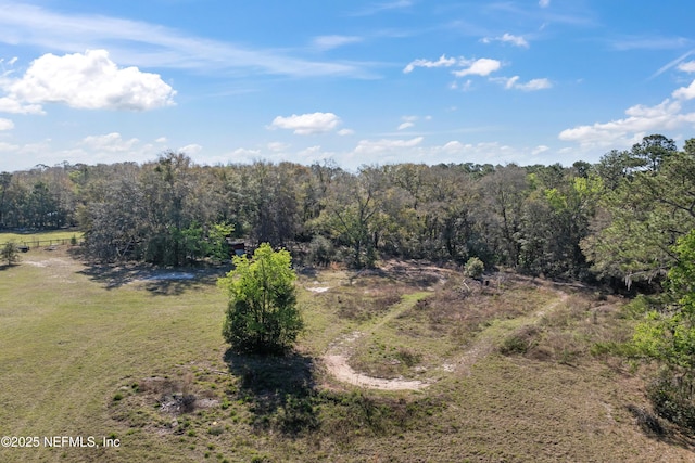 aerial view featuring a view of trees