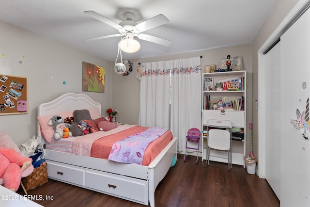 bedroom with a closet, ceiling fan, and wood finished floors