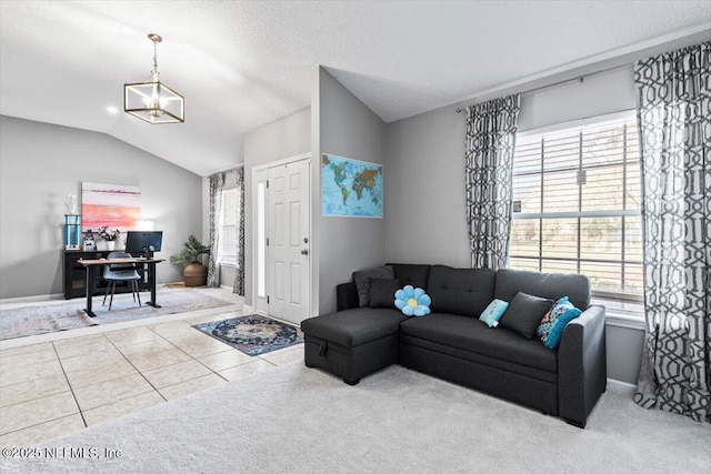 tiled living area featuring carpet floors, a textured ceiling, baseboards, and vaulted ceiling