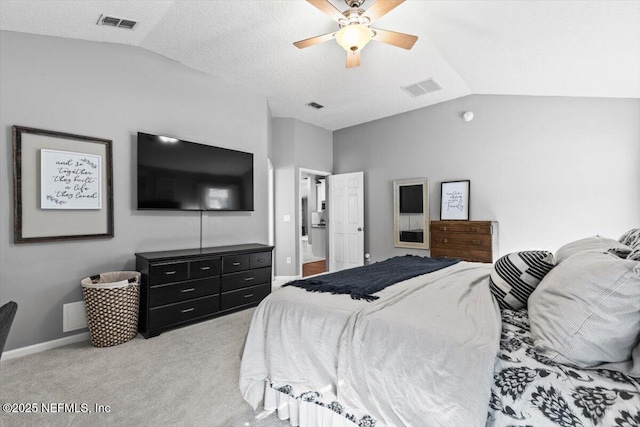 bedroom featuring light carpet, visible vents, and vaulted ceiling