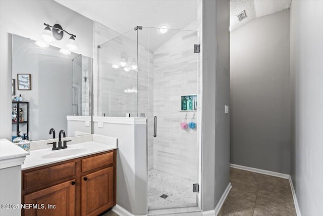 full bath featuring visible vents, baseboards, a stall shower, tile patterned floors, and vanity