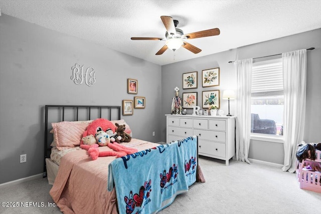 bedroom featuring a textured ceiling, ceiling fan, baseboards, and light carpet