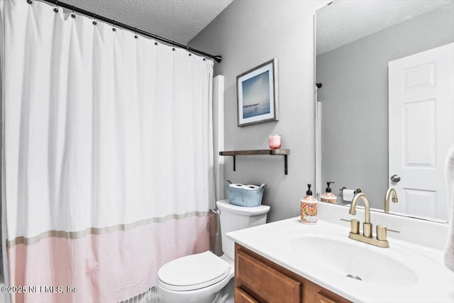 bathroom featuring curtained shower, a textured ceiling, vanity, and toilet