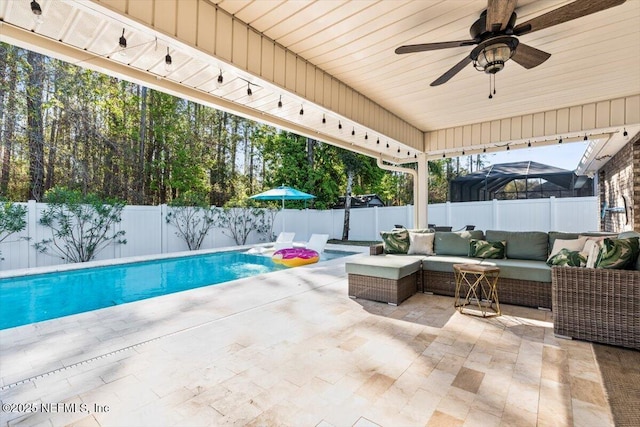 view of patio with ceiling fan, outdoor lounge area, a fenced backyard, and a fenced in pool