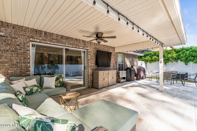 view of patio / terrace featuring an outdoor living space, ceiling fan, fence, outdoor dining space, and a grill