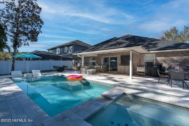 view of pool featuring a patio area, outdoor lounge area, outdoor dining area, and fence