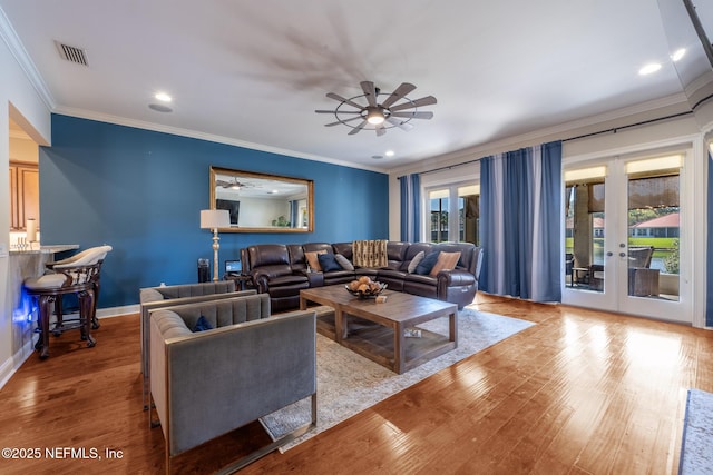 3808 Catania Pl, Jacksonville, FL 32224 - living room featuring wood finished floors, a ceiling fan, visible vents, and french doors
