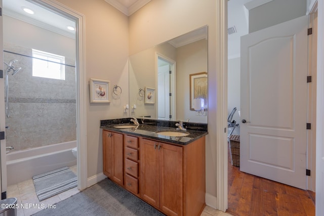3808 Catania Pl, Jacksonville, FL 32224 - full bath with double vanity, crown molding, visible vents, and a sink