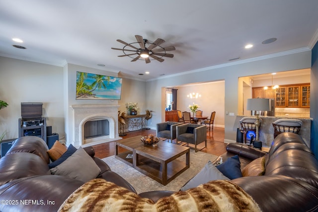 3808 Catania Pl, Jacksonville, FL 32224 - living room with ornamental molding, a fireplace with flush hearth, wood finished floors, and ceiling fan