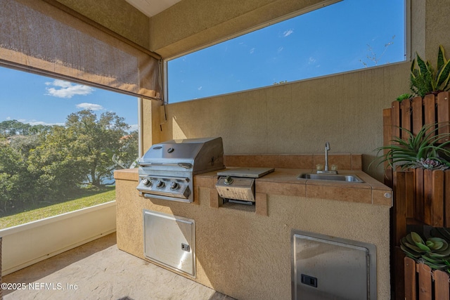 3808 Catania Pl, Jacksonville, FL 32224 - view of patio featuring a sink, an outdoor kitchen, and a grill