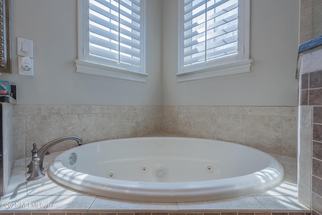 3808 Catania Pl, Jacksonville, FL 32224 - bathroom featuring a wealth of natural light and a whirlpool tub