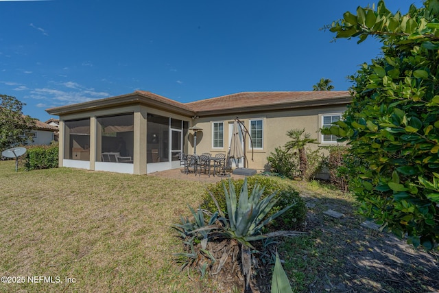 3808 Catania Pl, Jacksonville, FL 32224 - back of property featuring a tile roof, stucco siding, a yard, a sunroom, and a patio area