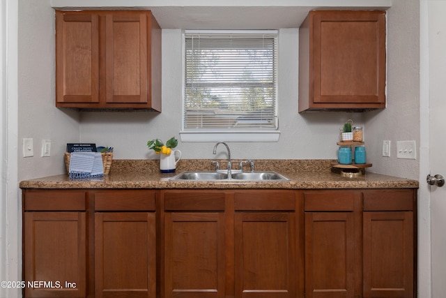 kitchen with a sink and brown cabinets