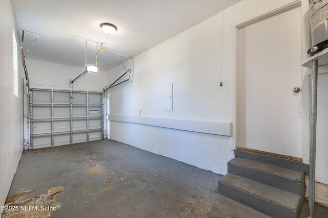 garage with electric panel and a garage door opener