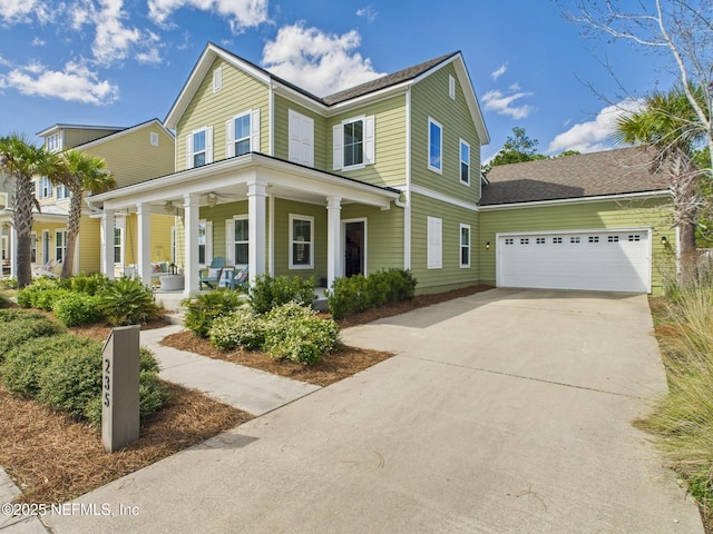 view of front of property featuring a porch, an attached garage, and driveway