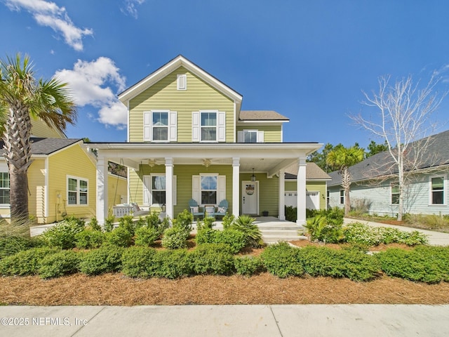 view of front of home with a garage and covered porch