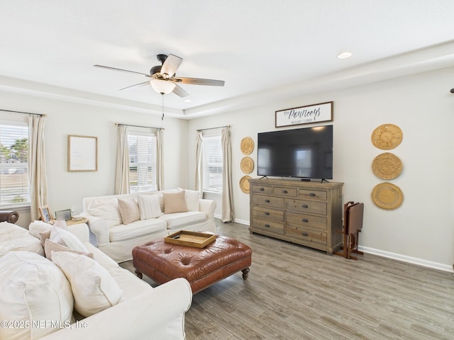 living room with recessed lighting, baseboards, ceiling fan, and wood finished floors