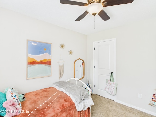 bedroom featuring baseboards, a ceiling fan, and carpet
