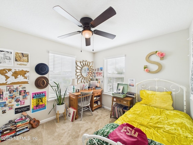 bedroom with baseboards, ceiling fan, and carpet flooring