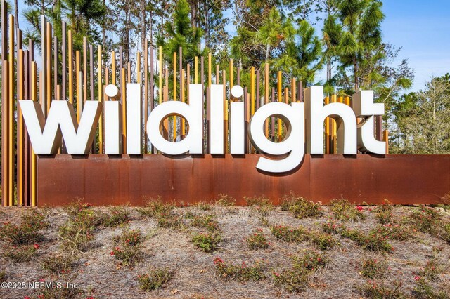 community sign with fence