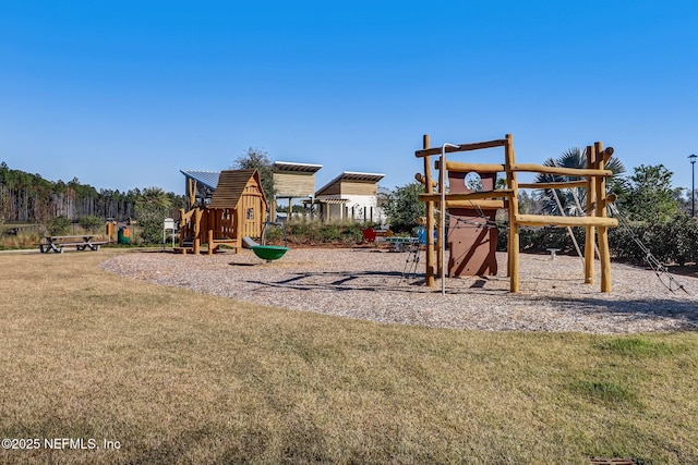 view of jungle gym featuring a lawn