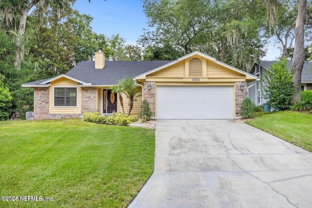 single story home with a garage, a front yard, a chimney, and driveway