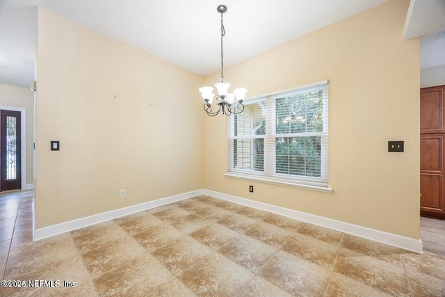 unfurnished dining area with baseboards and a notable chandelier