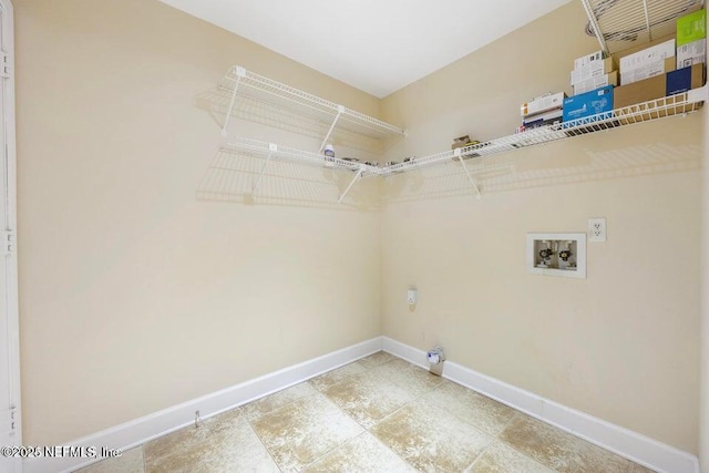 washroom with laundry area, electric dryer hookup, baseboards, and washer hookup