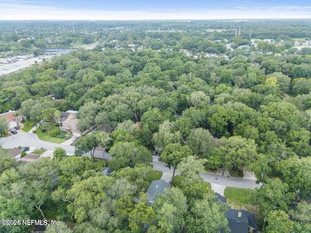 aerial view with a wooded view