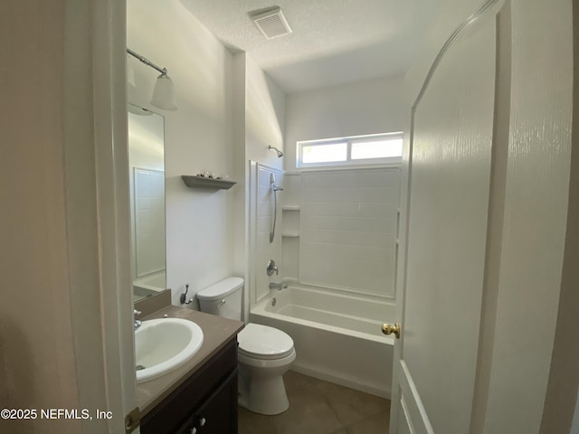 bathroom with vanity, visible vents, tile patterned flooring, a textured ceiling, and toilet