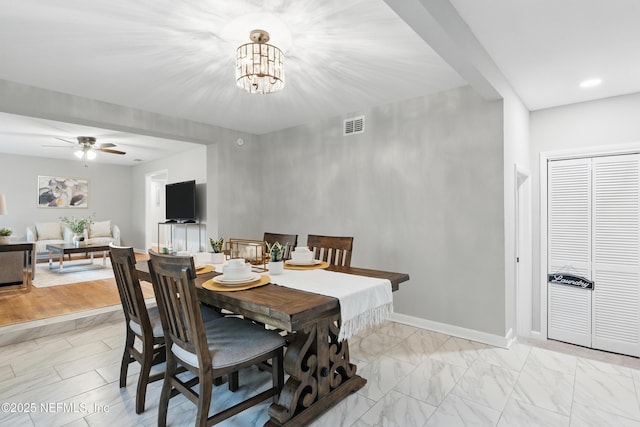 dining space with visible vents, baseboards, recessed lighting, ceiling fan with notable chandelier, and marble finish floor