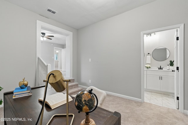 living area with visible vents, marble finish floor, baseboards, light colored carpet, and ceiling fan