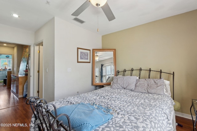 bedroom featuring visible vents, wood finished floors, recessed lighting, baseboards, and ceiling fan