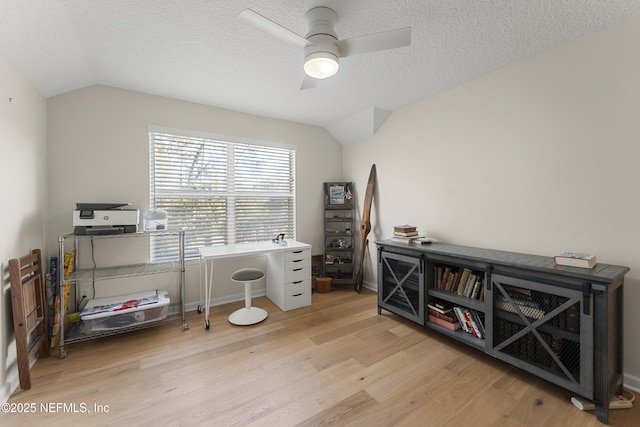 office space with lofted ceiling, a textured ceiling, wood finished floors, and a ceiling fan