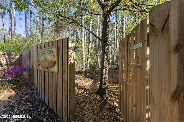 view of gate featuring fence