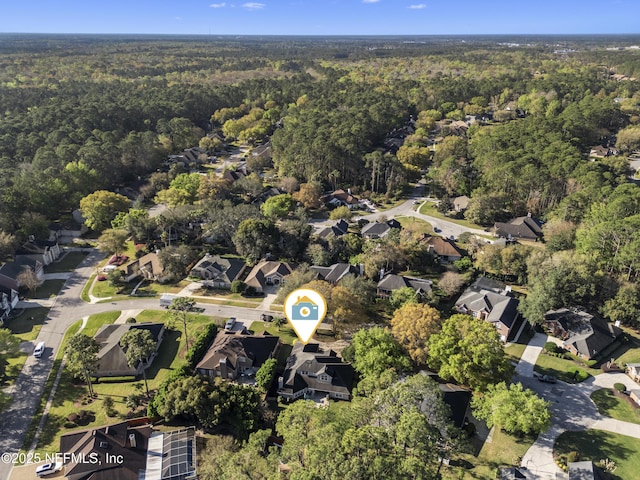 bird's eye view with a residential view and a forest view