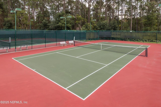 view of sport court featuring community basketball court and fence