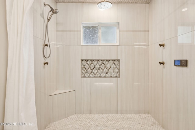 full bath featuring a tile shower