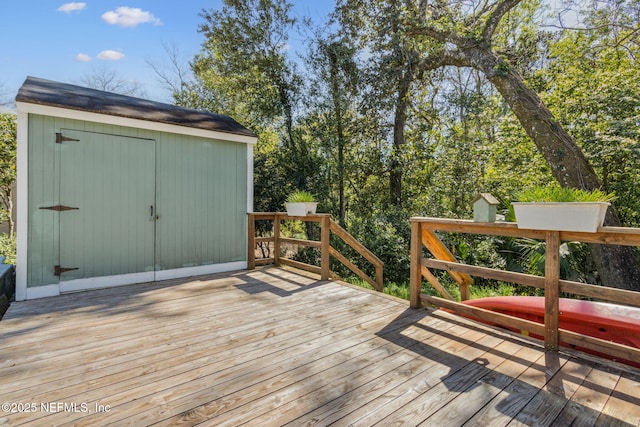 deck featuring a storage shed and an outdoor structure