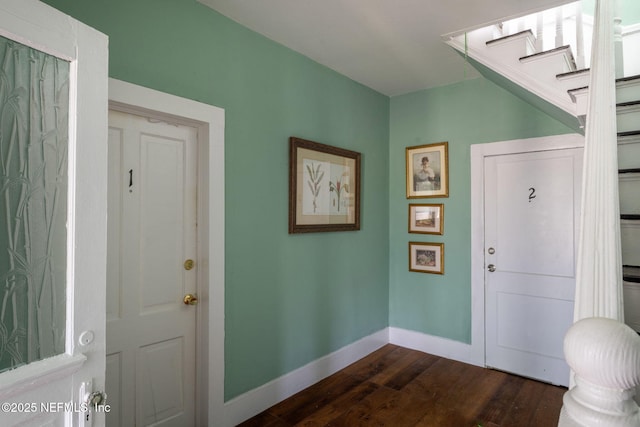 346 N Cherry St, Starke, FL 32091 - foyer with baseboards, dark wood-style flooring, and stairway