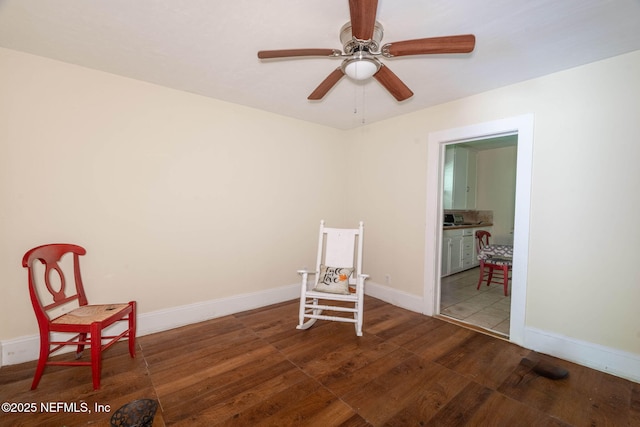 346 N Cherry St, Starke, FL 32091 - sitting room featuring a ceiling fan, baseboards, and wood finished floors