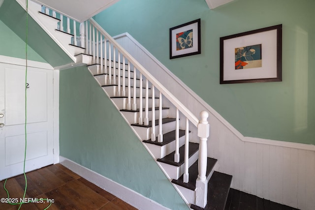 346 N Cherry St, Starke, FL 32091 - stairway with wainscoting and wood finished floors