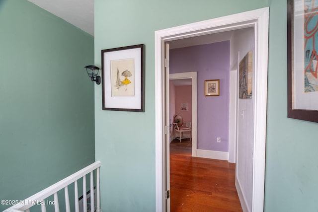 346 N Cherry St, Starke, FL 32091 - hallway with baseboards, an upstairs landing, and wood finished floors