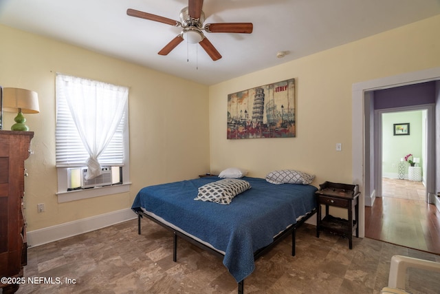 346 N Cherry St, Starke, FL 32091 - bedroom with cooling unit, baseboards, and ceiling fan