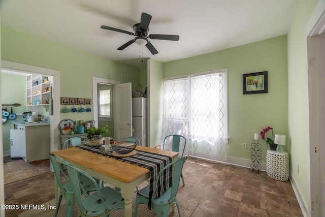 346 N Cherry St, Starke, FL 32091 - dining area featuring baseboards and ceiling fan