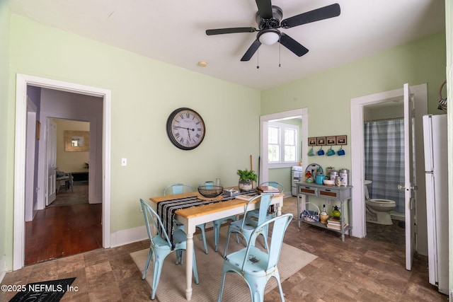 346 N Cherry St, Starke, FL 32091 - dining area featuring baseboards and a ceiling fan