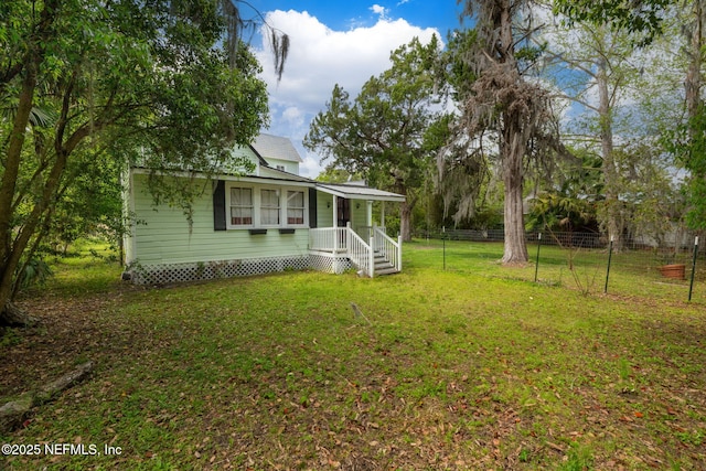 346 N Cherry St, Starke, FL 32091 - view of front of home with a front yard and fence
