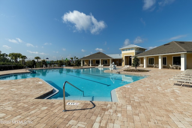 pool with a patio area